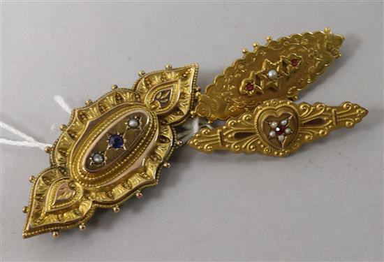 Three early 20th century 9ct gold and gem set bar brooches. largest 2.25in.